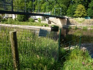 This fence marks the upper fishing limit of the Bingley Angling Club stretch of the River Wharfe at Wray Wood, Boston Spa