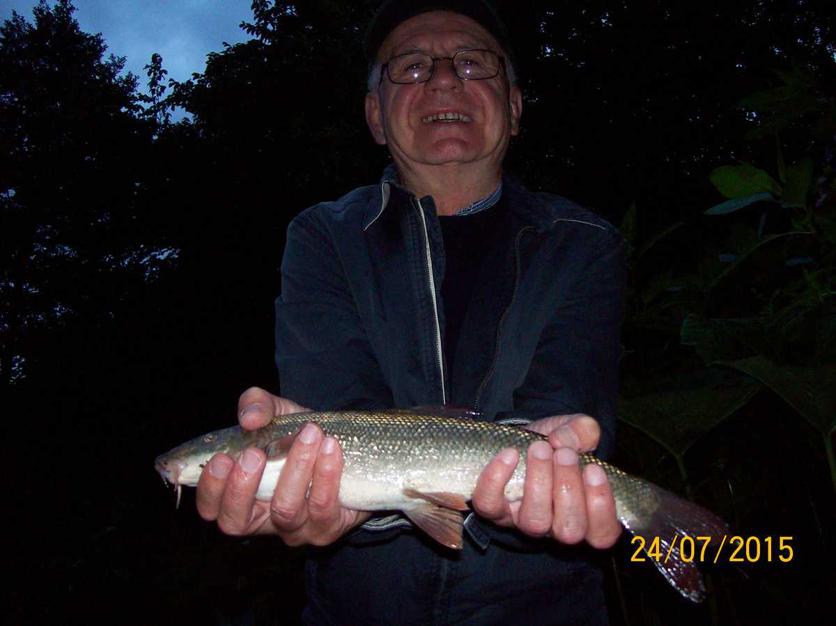 Bingley AC life member Kevin Sunderland with a River Aire Barbel.
